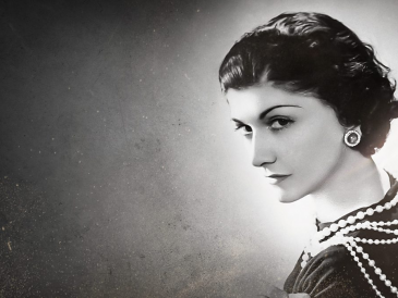 Coco Chanel portrait with classic style outfit