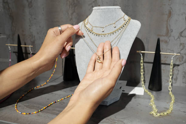 Woman wearing multiple pendants on a single chain